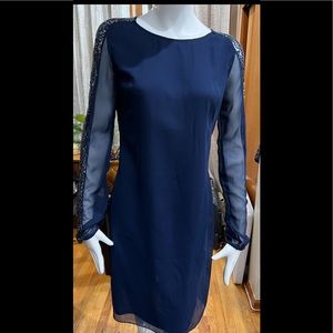 Boutique Beautiful Navy Blue Dress with Shear Sleeves with Beading Details.
